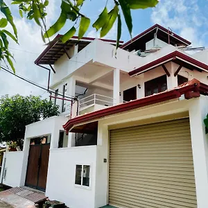 https://house-sand-surf.kandyhotelsnow.com
